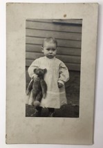 Adorable Baby Girl Holding Teddy Bear RPPC Antique PC AZO Infant in Whit... - £12.59 GBP