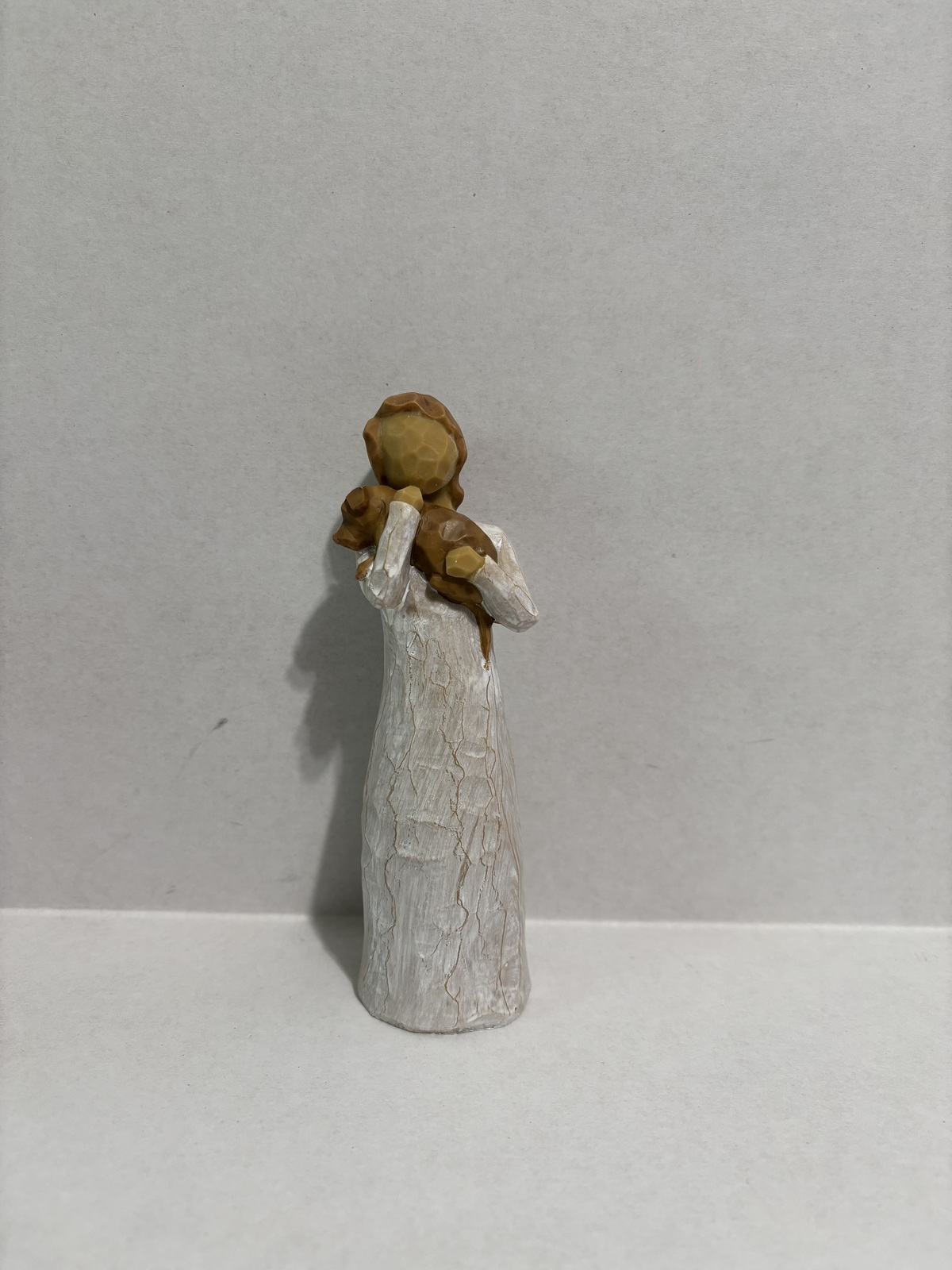 Woman Holding Dog Statue - $24.00