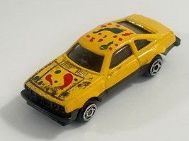 Diecast Yellow &amp; Black Metal Car with Colorful Paint Splatter 1:64 - $2.19