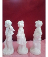 3 white porcelain figurines..2 boys and a girl - $55.98