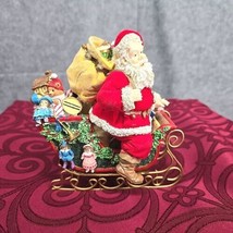 Santa Figurine With Presents on a Sleigh Resin Metal Flocked Coat and Bag  - $13.54