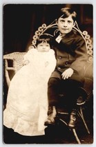 RPPC Boy with Baby Sister Looking Like a Ventriloquist with Doll Postcar... - £14.60 GBP