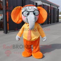 Orange Elephant mascot costume character dressed with a Dress Pants and Reading  - $1,289.00