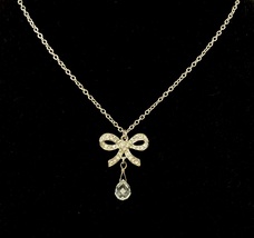 Crystal bow pendant necklace with faceted briolette teardrop charm very feminine - $10.00