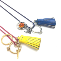 Charm Necklace Lot of Two Pink Blue Ring Bird Sword Tassel Crafting - $8.00