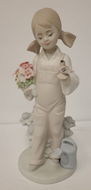 Lladro Figurine #5217 Spring Girl Holding Bird Flowers - $59.35
