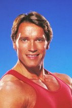 Arnold Schwarzenegger muscular pose in red workout vest 1980's 24x18 Poster - $23.99