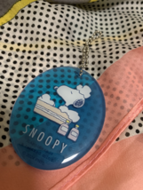Acrylic keychain of Snoopy in bubbles, with a cute blue design - $18.55