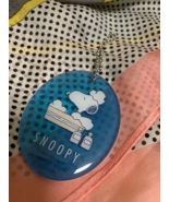 Acrylic keychain of Snoopy in bubbles, with a cute blue design - $18.55