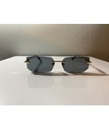 Unisex, rimless, rectangular sunglasses with minimalist frame and gray l... - $187.81 MXN