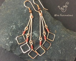 Handmade copper earrings: long diamond dangles with metallic red beads - £24.12 GBP