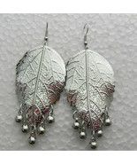 SILVER LEAF DANGLE EARRINGS - $127.76 MXN