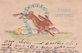 Easter Greetings Rabbit Jumping Flower Wreath 1906 Postcard D49 - $2.99