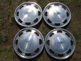 Factory original 1986 to 1990 Ford Tempo Aerostar 14 inch hubcaps wheel covers - $46.40