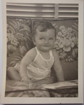 Vintage Grinning Baby Girl Looking At A Book Black &amp; White Photo 1950s - $3.99