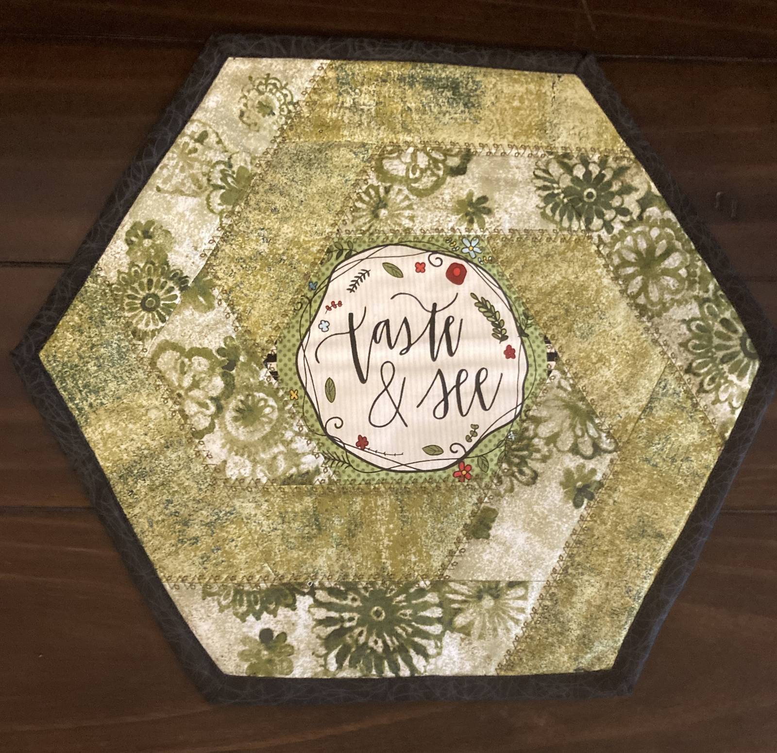 April  Taste &amp; See Hexagon Quilted Table Topper - $25.00