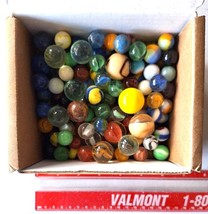  A BOX OF MARBLES - $40.00