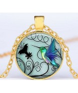 a Round capsule with Art of a Hummingbird with background in Black &amp; Gol... - $32.61 CAD