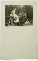 RPPC Home Garden Resting on Fence Women with Tongues Out Real Photo Postcard H12 - £10.24 GBP