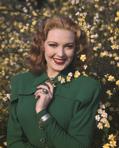 Linda Darnell beautiful smiling pose by flowery plant green coat 16x20 C... - $69.99