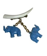 Vintage Brooch Plastic Celluloid Blue Elephants Hanging from Plastic Tusk - $461.34 MXN