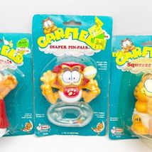 Lot Of 3 Vintage Garfield Baby Rattle Diaper Pin &amp; Squeeze Pals Jim Davi... - £35.41 GBP