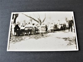 Large group of people sitting in garden outdoors - RPPC-AZO (1918-1930).     - £9.34 GBP