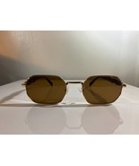 Unisex, oval shaped sunglasses with brown lenses and gold wire frame. - $10.00
