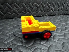 Vintage LEGO 1980&#39;s Set Yellow Blue Clear Blocks &amp; Red Black Wheels - £19.77 GBP