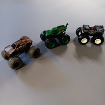 3 diecast mini monster trucks  - $21.09 CAD