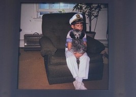 Vintage Photo Slide Your Boy Dressed As Boat Captain Holding Dog in Chair 1974? - £7.94 GBP