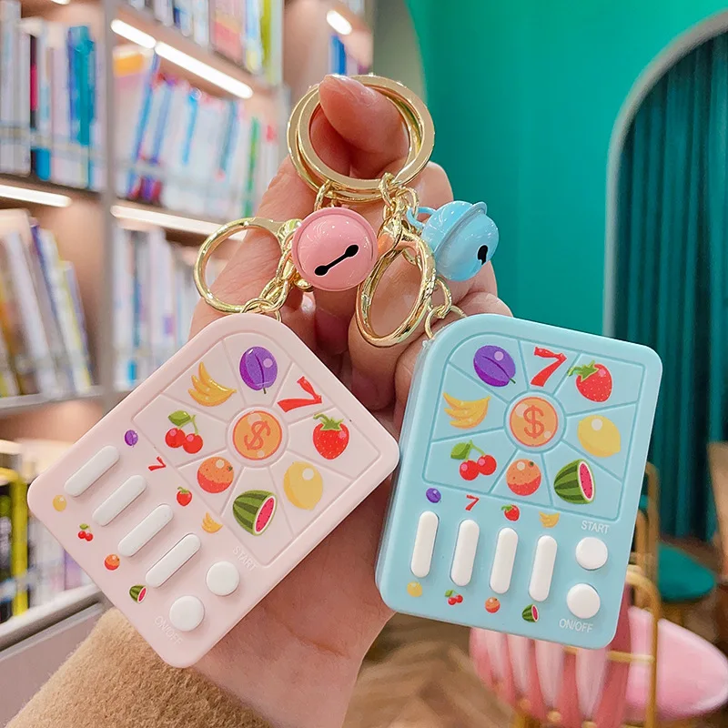 Creative Keychain Rocking Toy Cartoon Backpack Pendant Fruit Machine Game - £7.78 GBP+