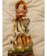  Old woman carrying bag of ducks with dog by her side figurine  6 1/2  - $126.85 MXN