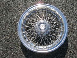 One genuine 1986 to 1995 Chevy Caprice 15 inch wire spoke hubcap - $93.15