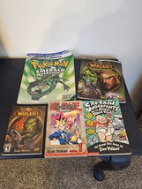 Lot of 5 books: Pokemon Emerald, 2 World of Warcraft Yu-Gi-Oh Captain Underpants - £14.01 GBP