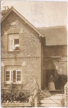 Postcard RPPC Mother Coming Out The Door Stone House - $6.92