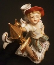 Vintage Ucagco Lamplighter Boy figurine candle stick holder with match r... - $11.85