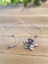 Metal flower pendants  with bead on leather cord - $25.00