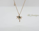 NIB Swarovski 5371158 Palm Pendant Necklace Clear Crystal Green Gold Pla... - $59.95