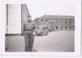 Antique Photo WW2 Era Soldier In Front Of Barracks Trucks - £2.32 GBP