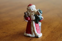 Christmas Village Figurine Santa Claus Holding Child Gift Toy Bag Doll B... - $8.55