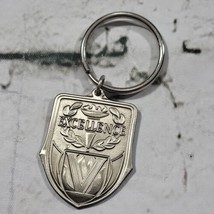 Excellence Keychain Silver-Tone Embossed Stamped 1998  - $9.89