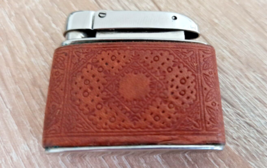 Small German gasoline lighter with leather insert. 1960-70 - $36.63