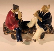 Ceramic Figurine Two Men Sitting On A Bench With Fans- 3&quot; Color: Blue &amp; Red - £7.94 GBP
