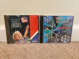 Lot of 2 True Value Promo CDs: The Joyous Sounds of America, Happy Holidays V.35 - £6.82 GBP
