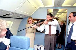 RONALD REAGAN ON AIR FORCE ONE PLAYING AROUND WITH A RIFLE PUBLICITY PHO... - $8.60