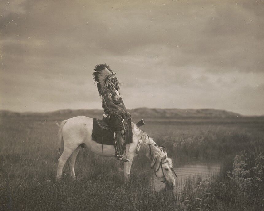 Oglala warrior Red Hawk sits on a horse in the Badlands South Dakota Photo Print - $8.81 - $14.69