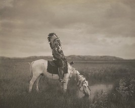 Oglala warrior Red Hawk sits on a horse in the Badlands South Dakota Photo Print - $8.81+