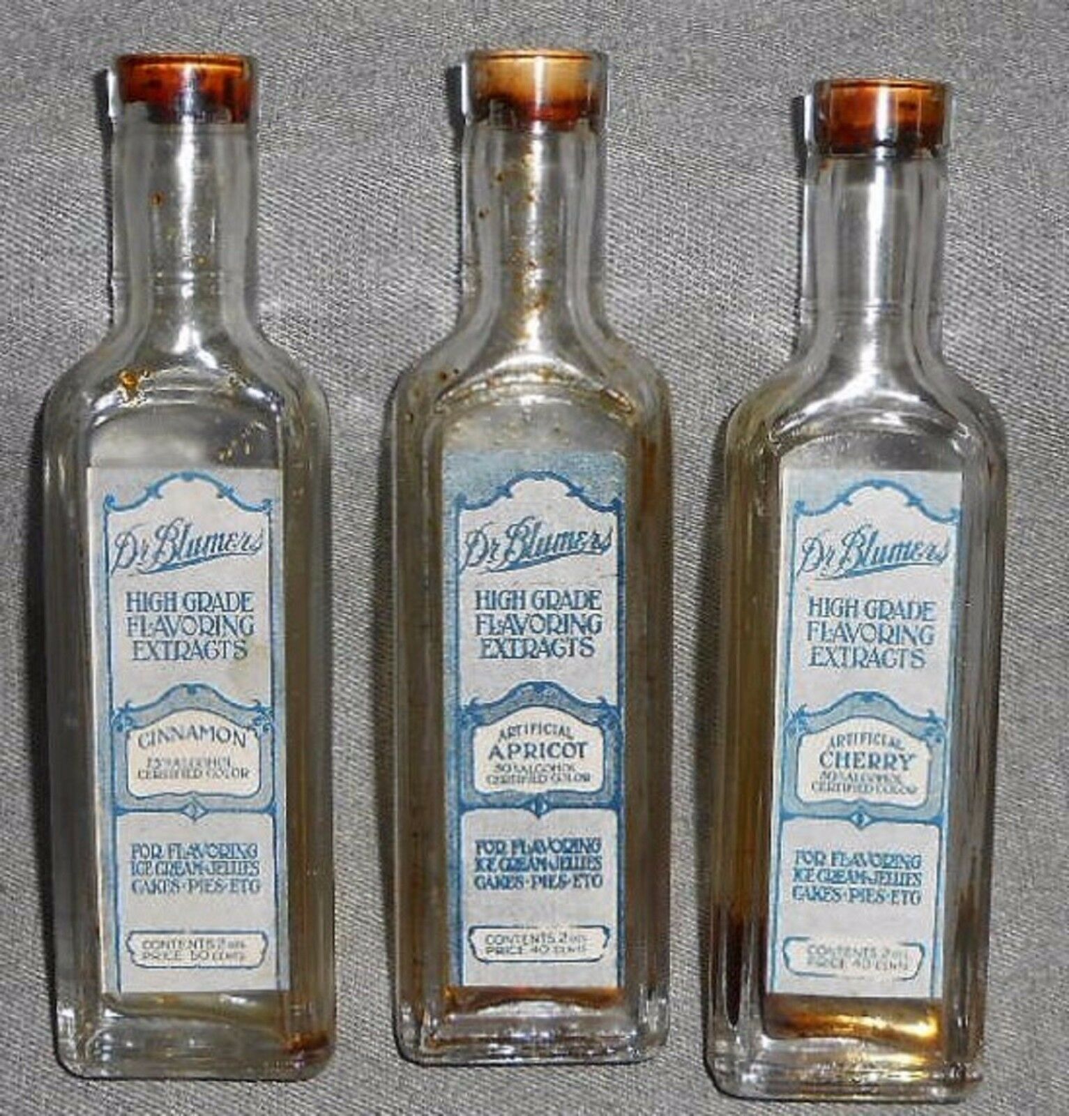 Primary image for 1920s Set (3) Dr Blumers 2 oz HIGH GRADE FLAVORING EXTRACT Bottles w/Labels NICE