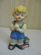 Figurine Statue Bisque Ceramic Little Boy Carrying His Books - £6.37 GBP